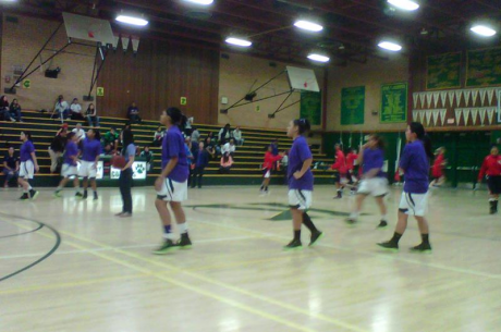 Kennedy Varsity team members warming up in purple, "the color for domestic violence awareness."  Both school teams, all levels, and audience wore purple, as well as Kennedy Varsity coaches.  Thanks to Soroptimists Int'l of Sacramento for co-sponsoring the event and Kennedy JV Coach Russell Fong helping arrange it. This was the first such game in Sacramento, and perhaps in the state too!